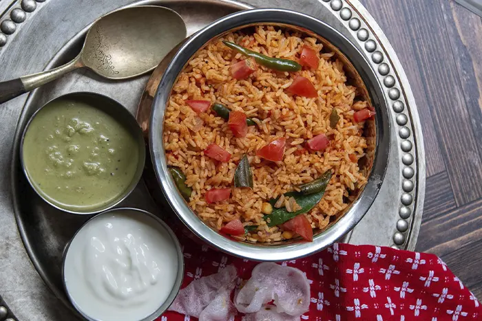 Tomato rice, Bajji, Egg and Sweet